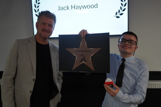 Linkage College student, Jack receiving the 2025 SEND Environment Award from 'The Canoe River Cleaner,' James Elliot.